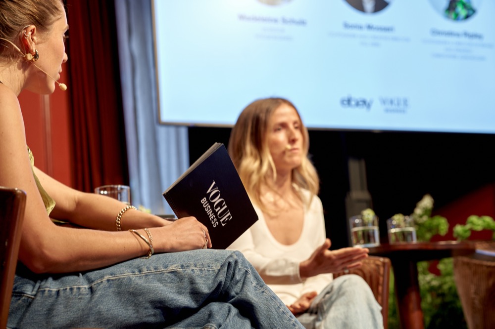 An on-stage conversation at the eBay Fashion Forum, with a Vogue Business notebook in the foreground
